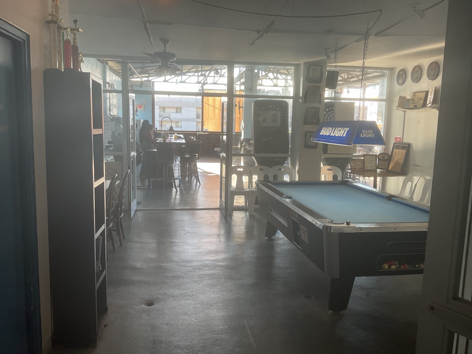 Trophies and the pool table near the deck entrance