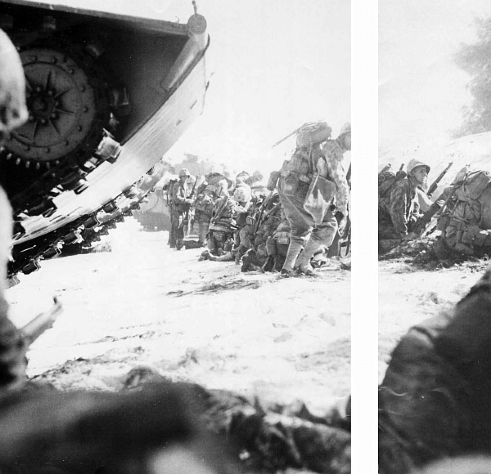 The first assault wave hits the beach and Marines prepare to fight their way inland, June 15, 1944