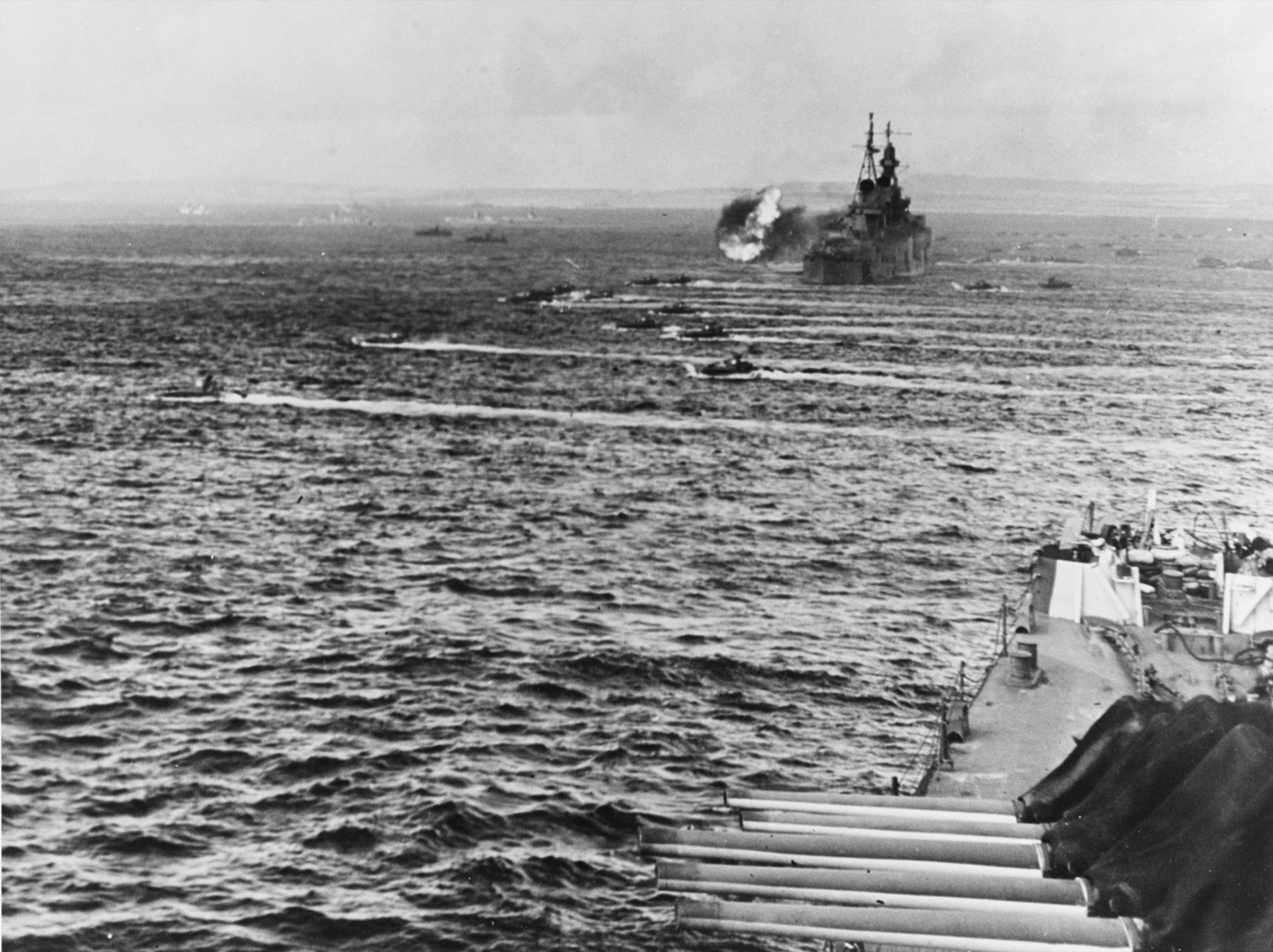 LVTs move toward Saipan past bombarding cruisers, June 15, 1944